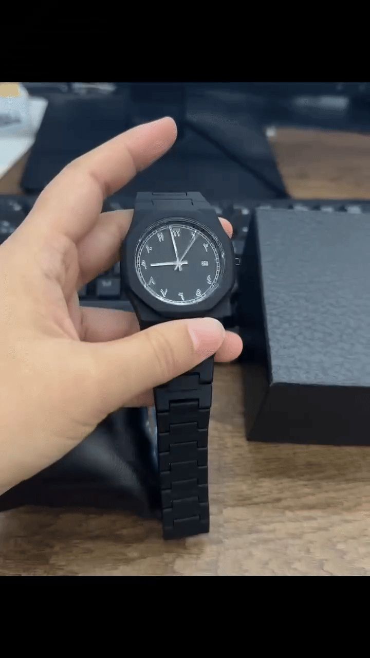 Arabic Aura Watch water resistance test showing stainless steel durability