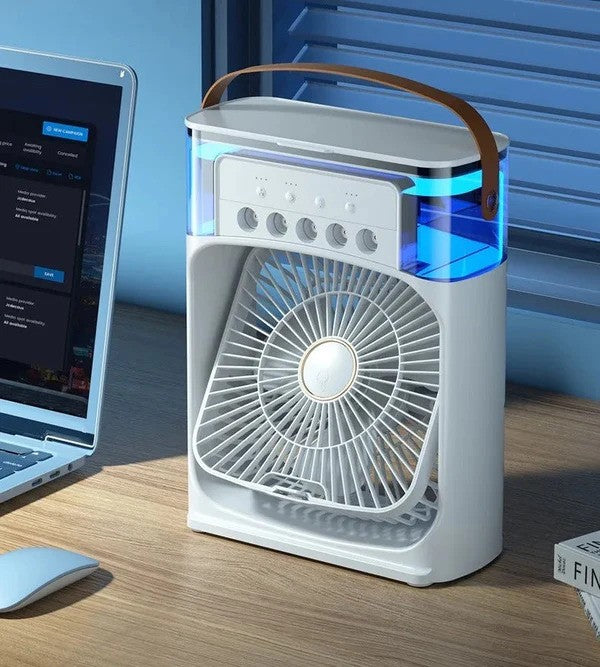 Portable air cooler on office desk next to laptop - compact white design with blue LED lighting and wooden handle